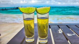 best gay friendly Caribbean honeymoons Cancun drinks on table by beach